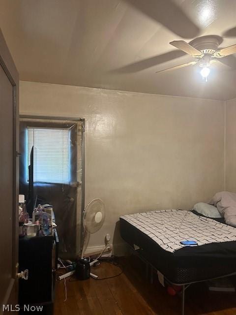 bedroom featuring hardwood / wood-style flooring and ceiling fan