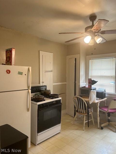 kitchen with ceiling fan and white appliances