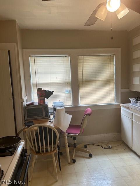 dining area with ceiling fan and cooling unit