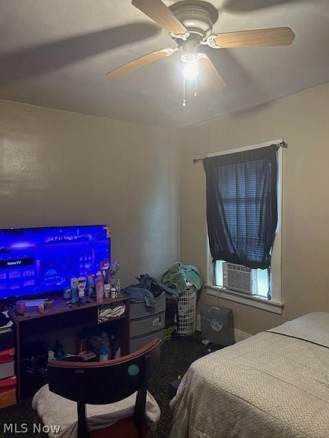 bedroom with ceiling fan and cooling unit