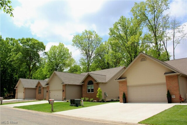 ranch-style home featuring a garage