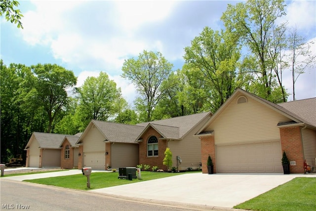 ranch-style home featuring a garage and a front yard