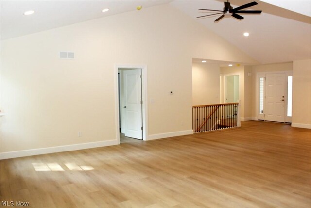 unfurnished room featuring high vaulted ceiling, ceiling fan, and light wood-type flooring