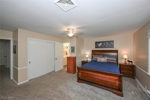 bedroom with visible vents, a ceiling fan, a closet, carpet floors, and baseboards