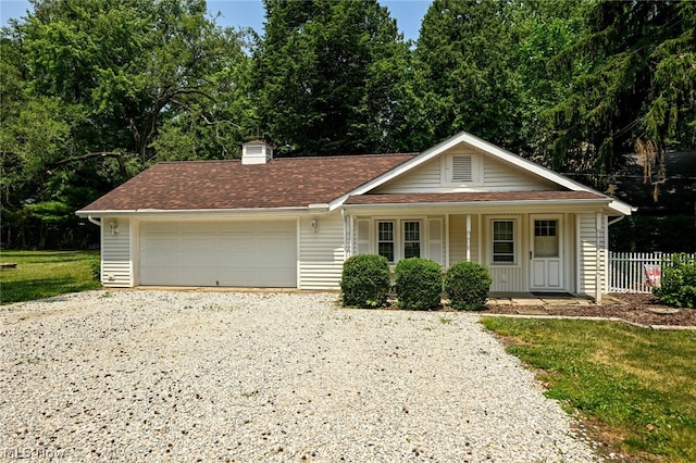 view of front of home with a porch and a garage