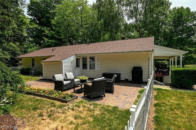 back of house featuring a patio area, an outdoor hangout area, a shingled roof, and fence