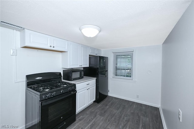 kitchen featuring visible vents, black appliances, dark wood-style floors, white cabinets, and baseboards