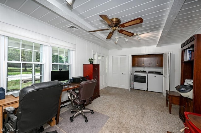 office featuring visible vents, light carpet, beam ceiling, separate washer and dryer, and ceiling fan