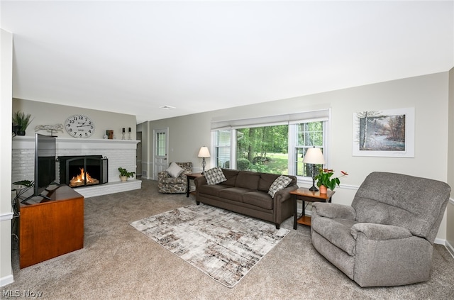 carpeted living room with a fireplace