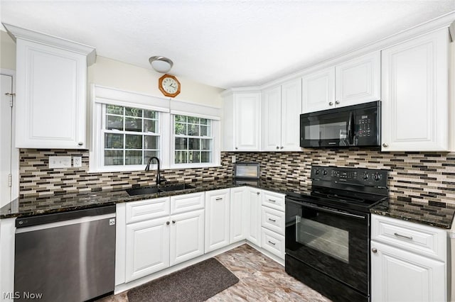 kitchen featuring a sink, decorative backsplash, black appliances, and white cabinetry