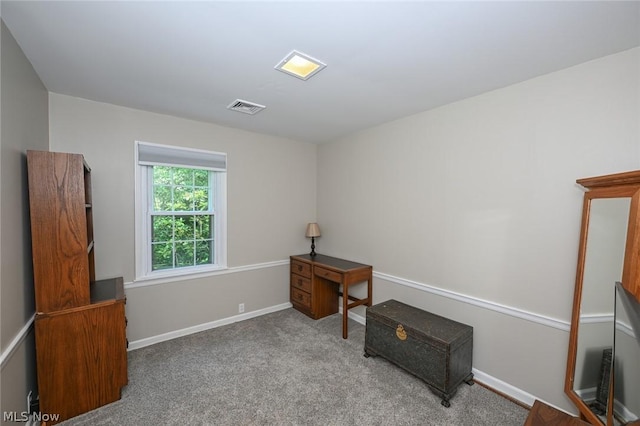 interior space with baseboards, visible vents, and carpet floors