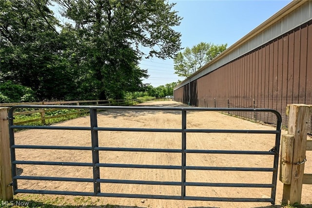 view of gate with an outdoor structure and an exterior structure