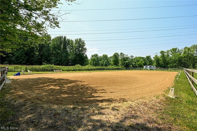 view of home's community with a rural view and an enclosed area