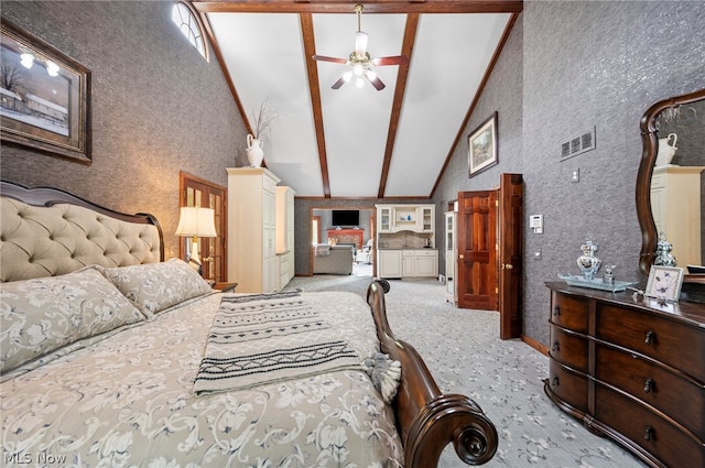 bedroom with high vaulted ceiling, ceiling fan, carpet, and beam ceiling