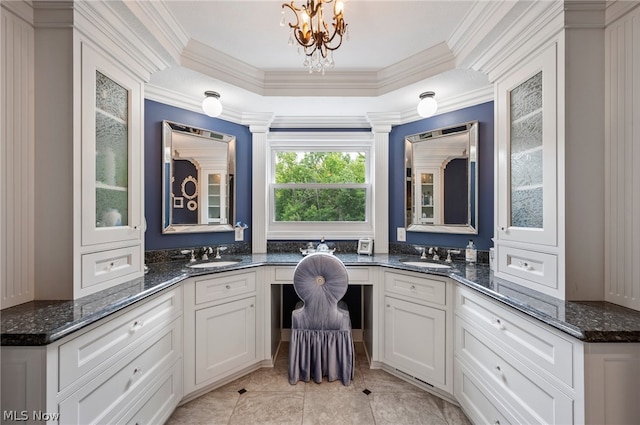 home office featuring a raised ceiling, ornamental molding, and light tile floors