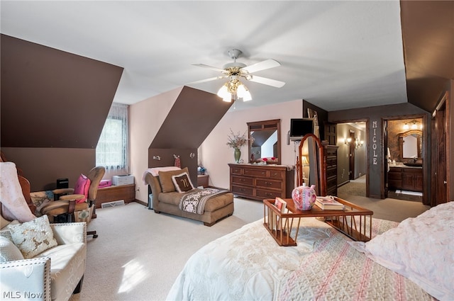 bedroom featuring carpet flooring, connected bathroom, ceiling fan, and lofted ceiling