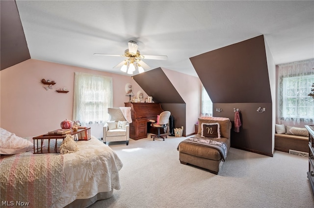 bedroom with carpet flooring, ceiling fan, and multiple windows