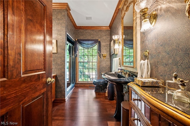 bathroom with hardwood / wood-style floors and crown molding