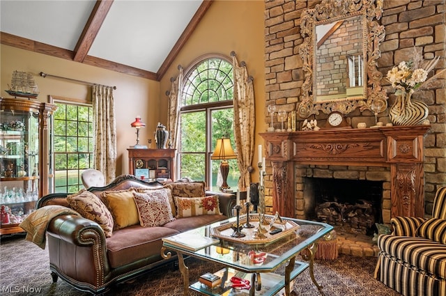 living room featuring carpet flooring, a stone fireplace, high vaulted ceiling, and beam ceiling