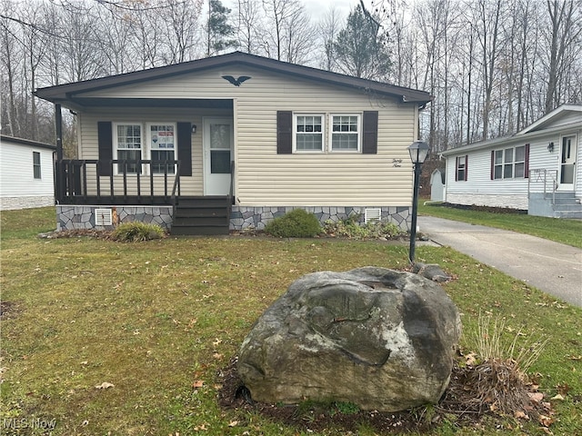 view of front of house featuring a front yard and a porch