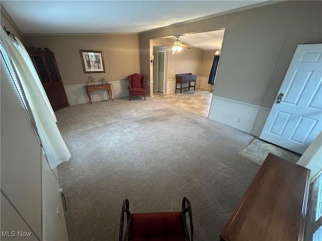 living room with ceiling fan and light carpet