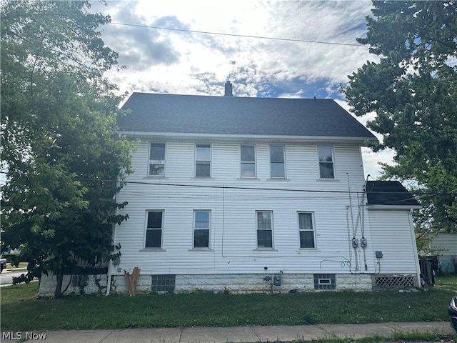 view of home's exterior with a lawn