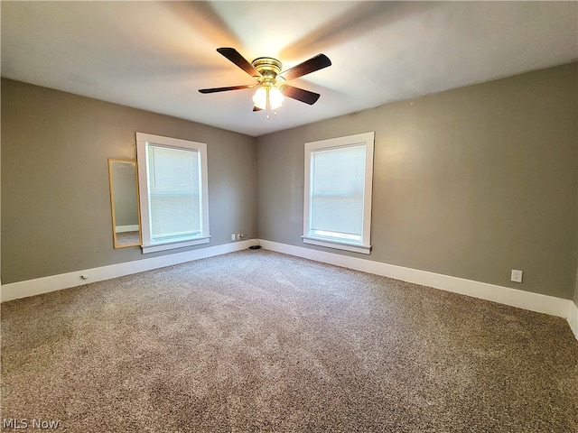 spare room featuring carpet flooring and ceiling fan