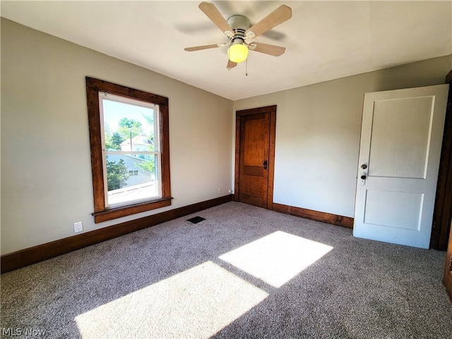 unfurnished bedroom featuring ceiling fan and carpet floors