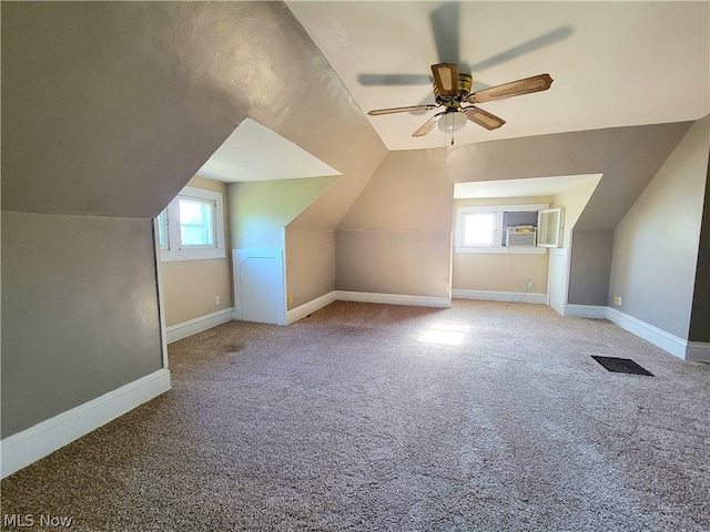 bonus room featuring ceiling fan, carpet floors, and lofted ceiling