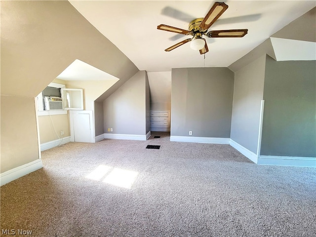 additional living space featuring lofted ceiling, carpet, and ceiling fan