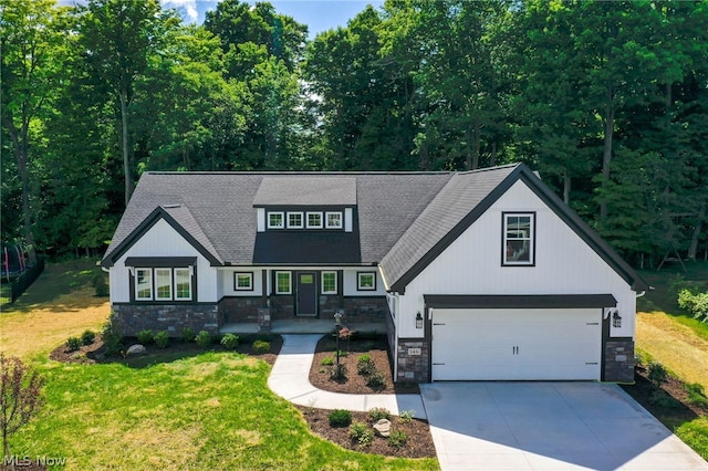 view of front of home featuring a garage and a front lawn