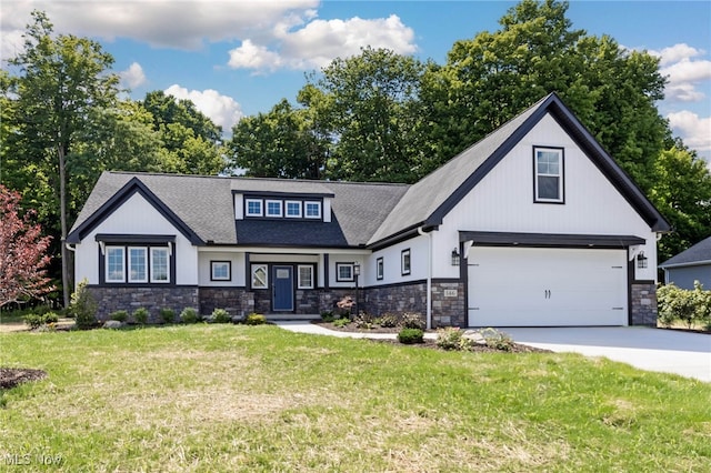 view of front of house featuring a front yard and a garage