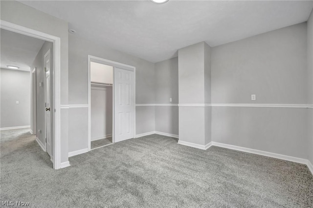 unfurnished bedroom with a closet and carpet