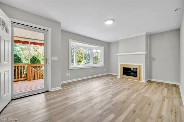 unfurnished living room featuring light hardwood / wood-style floors