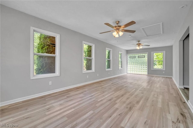 empty room with light hardwood / wood-style flooring