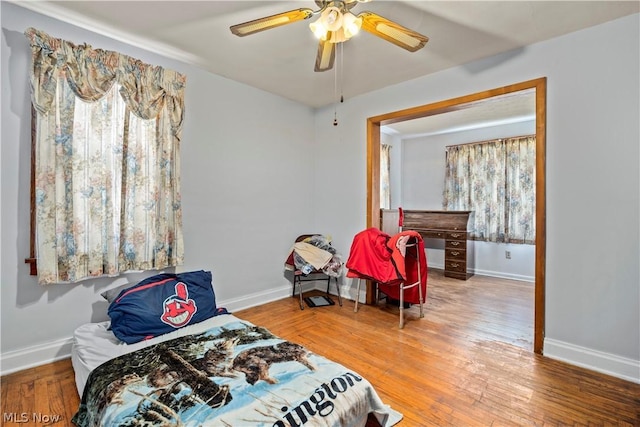 bedroom featuring ceiling fan and hardwood / wood-style floors