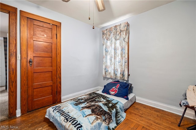 bedroom featuring wood-type flooring and ceiling fan