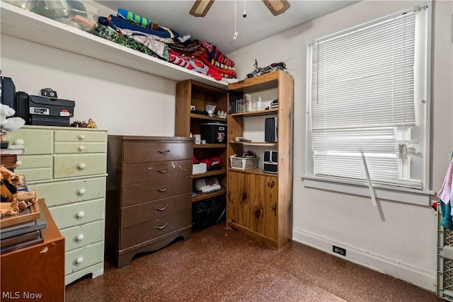 spacious closet with ceiling fan