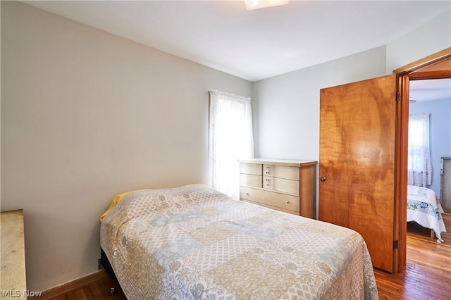 bedroom with wood-type flooring