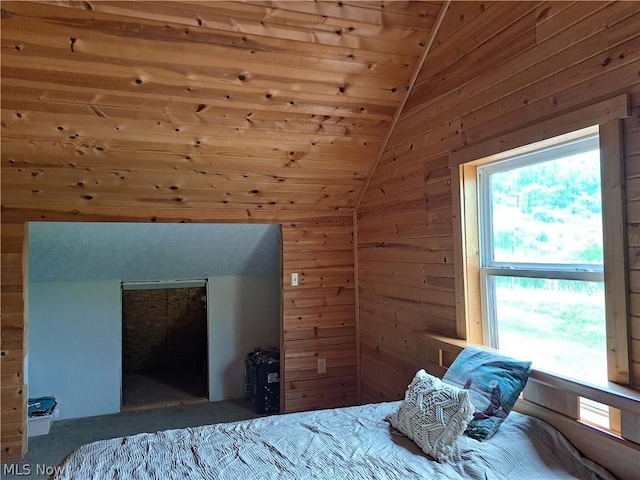 bedroom with wood walls, wood ceiling, and vaulted ceiling