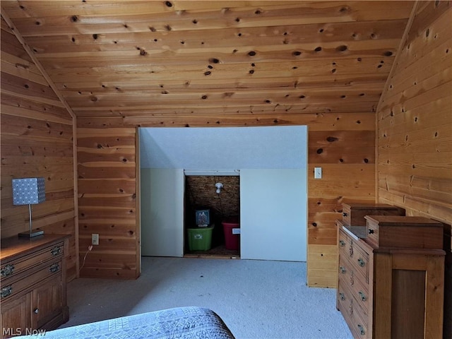 bedroom featuring wooden walls, wooden ceiling, and lofted ceiling