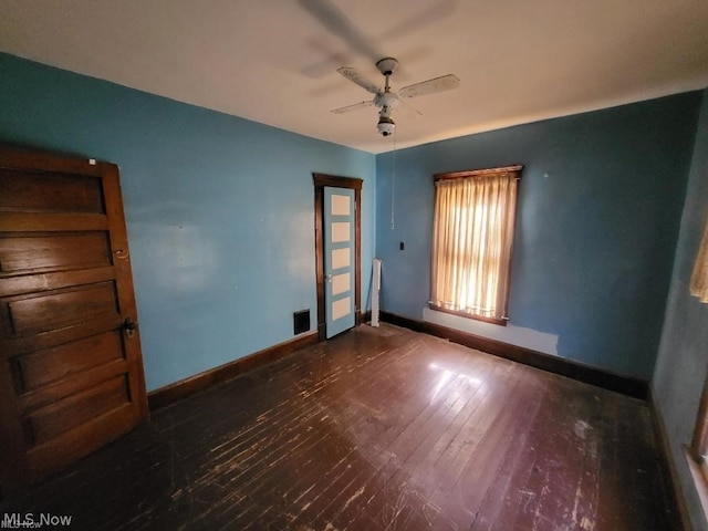 interior space featuring ceiling fan and dark hardwood / wood-style flooring