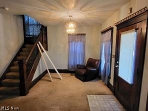 interior space with carpet and a chandelier