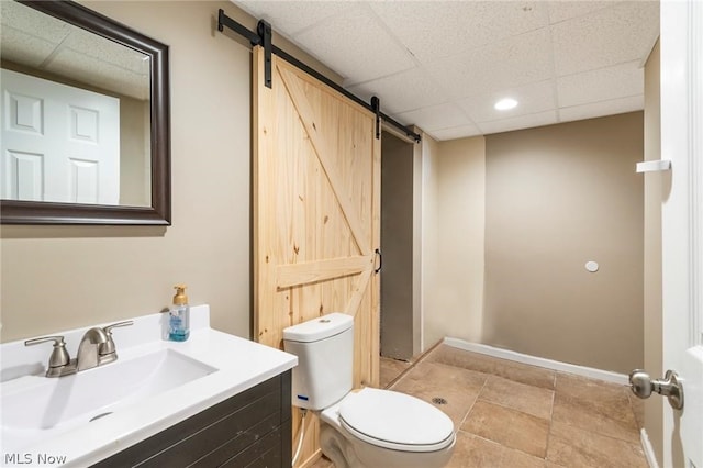 bathroom with tile patterned floors, vanity, and toilet