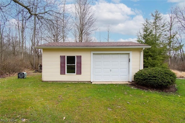 garage with a yard