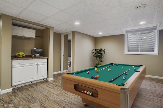 recreation room with a drop ceiling, light hardwood / wood-style floors, and billiards