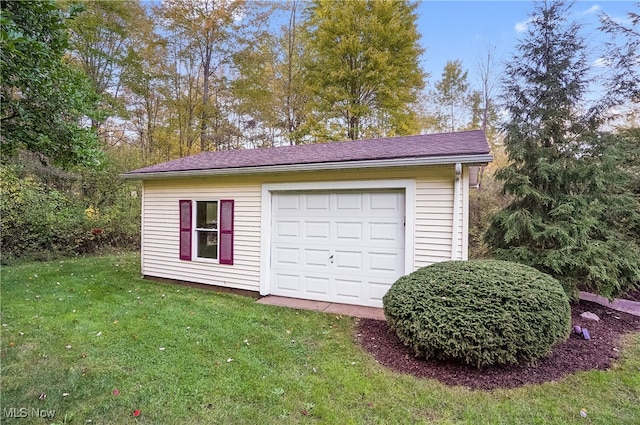 garage with a lawn