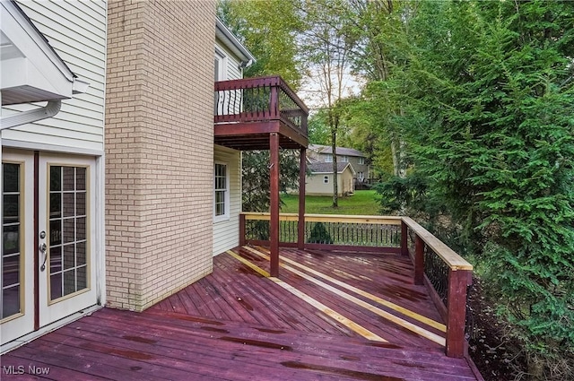 wooden deck featuring french doors