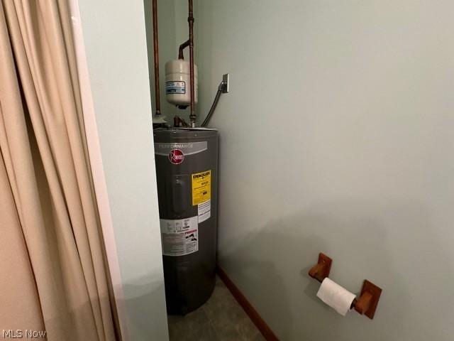 utility room featuring electric water heater