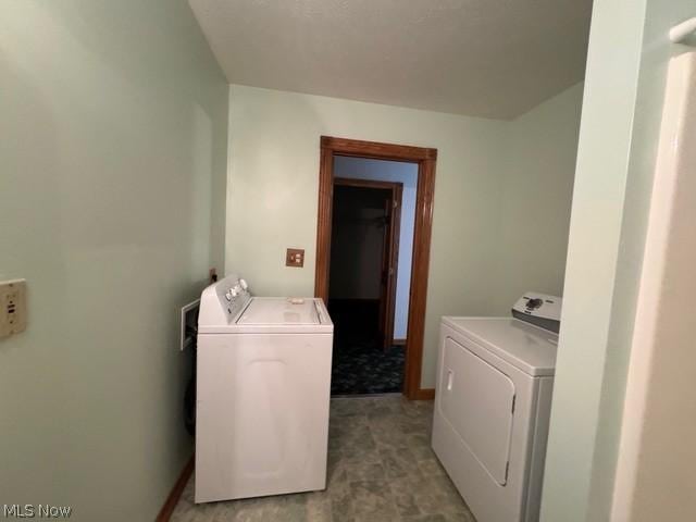 clothes washing area featuring washing machine and dryer